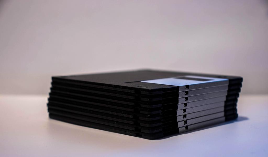 Cloud sync interface showing files being synchronized across laptop, tablet, and smartphone devices